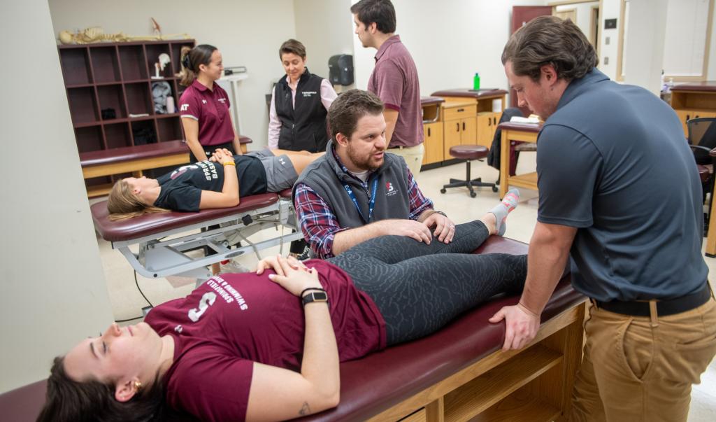 Athletic training faculty and students in the athletic training facilities at Springfield College