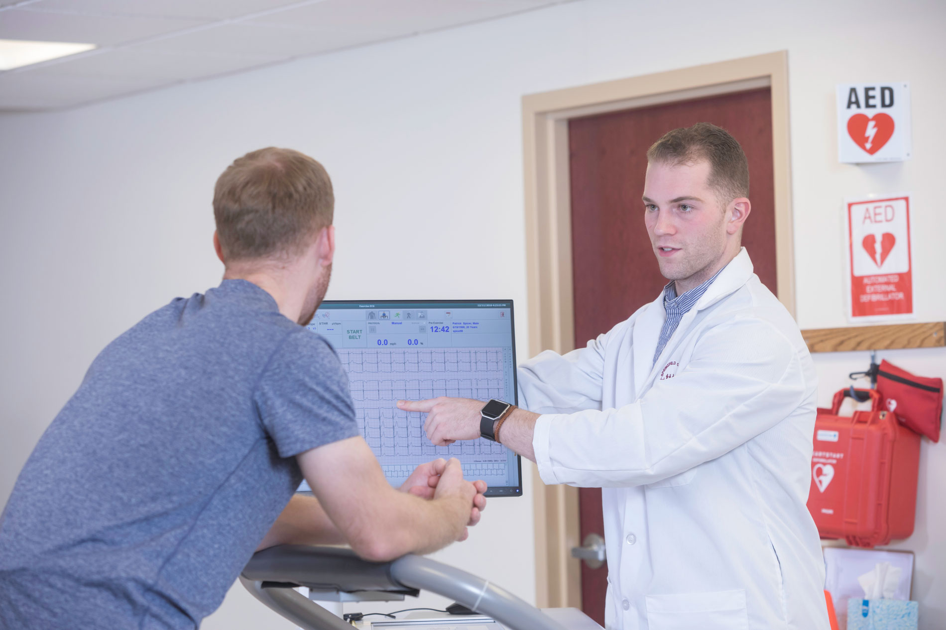 A PhD student works in a classroom with a patient